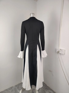 Detail view of the back of a slim-fit elegant backless dress with a white ruffled hem