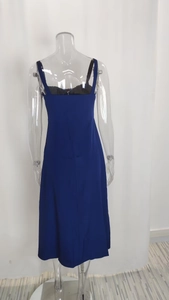 Detail view of the back of a navy floral spaghetti strap midi dress with a square neckline