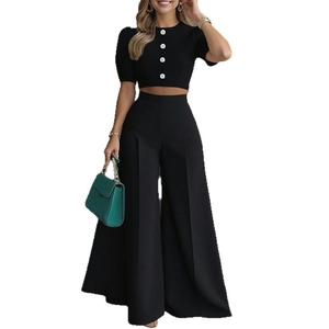 Women's black two-piece set with cropped button top and high-waisted wide-leg pants