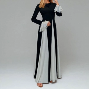 Retro black and white paneled long sleeve maxi dress with ruffled cuffs and slim waist