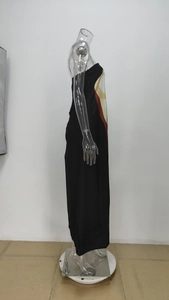 Detail view of black strapless maxi dress with colorful geometric floral patterns