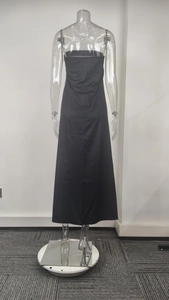 Rear view of minimalist black strapless maxi dress showing straight H-line silhouette