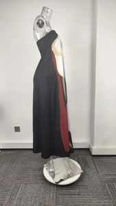 Detailed side profile of a black strapless maxi dress with colorful geometric floral prints