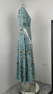 Elegant V-neck floral print maxi dress in light blue with short sleeves on mannequin