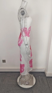 Side view of white tube dress featuring elegant pink floral prints and slim fit silhouette