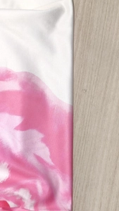 Close-up of the delicate floral print fabric and high-quality edge stitching of the dress