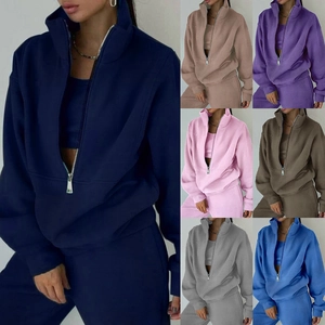 Women's half-zip sweatshirt and sweatpants set in a loose fit with seven color options