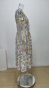 Side view of floral print sleeveless maxi dress on mannequin showing waist detail