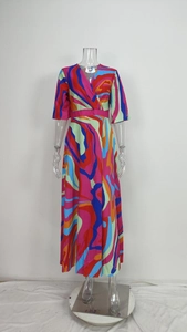 Detailed view of an elegant V-neck multi-colored abstract printed slim maxi dress
