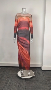 Detail of the elegant gradient pattern and slim fit fabric on a long sleeve midi dress