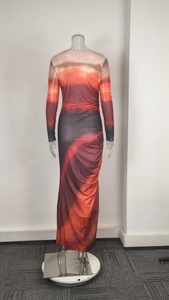 Detail of slim-fit maxi dress with sunset gradient print and side ruching effects