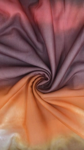 Detail of elegant gradient mesh fabric showing red, purple and orange color transitions