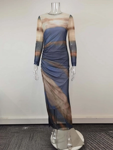 Detail of elegant bodycon dress featuring blue and tan abstract print with side ruching