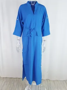 Detail of blue V-neck dress featuring waist drawstring and side slit hem design