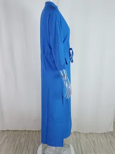 Detail view of the side slit and adjustable drawstring waist on the blue maxi dress