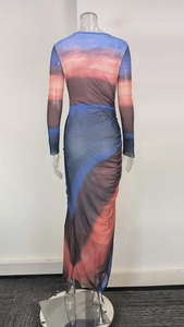 Detail of elegant gradient tie-dye mesh dress with side ruching and slimming fit