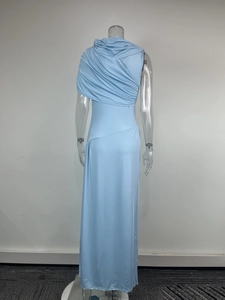 Detail view of sky blue sleeveless dress featuring elegant draped back pleats and cape design