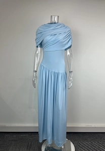 Detail of light blue sleeveless dress with crisscross draped pleats and elegant waistline