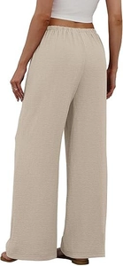 Back view of beige high-waisted wide-leg trousers showing elastic waistband and texture