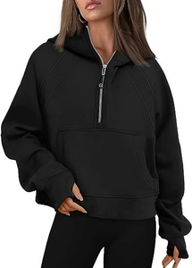 Detail of black half-zip hoodie with thumbhole cuffs and a front kangaroo pocket