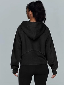 Rear view of women's black half-zip cropped hoodie with drop shoulder and large hood