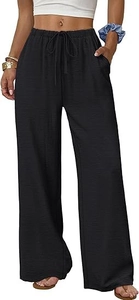 Detail of the textured black fabric and drawstring waistband on women's wide leg pants