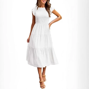 Elegant white smocked tiered midi dress with flutter sleeves and a flowy summer skirt
