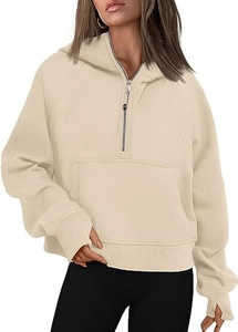 Detail of beige half-zip hoodie featuring long ribbed cuffs with thumbholes and front pocket