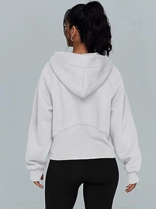 Detail of light grey yoga hoodie with curved back stitching and thumbhole cuffs