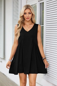 Detailed view of women's black V-neck sleeveless mini dress with pleated waist and pockets