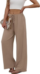 Detail showing the pleated texture fabric and drawstring elastic waist of beige wide leg pants