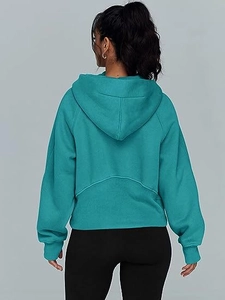 Rear view of loose-fit cyan hooded sweatshirt featuring stylish V-shaped stitching detail
