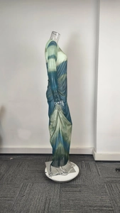 Detail view of ruching on gradient long sleeve bodycon dress with vibrant tie-dye pattern