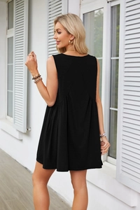 Detail of back pleated seam and V-shaped stitching on black sleeveless babydoll dress