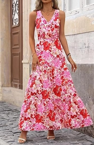 Detail of the V-neckline and tropical floral print on a long tiered maxi dress