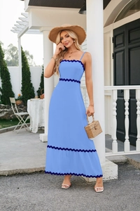 Detail of light blue midi dress showing navy scalloped trim and strap design