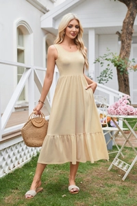 Detail of square neck midi dress with side pockets and ruffled hem in apricot