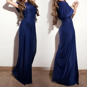 Detail of elegant dark blue pleated dress with wrap bodice and floor-length hemline