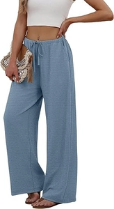 Detail of light blue wide-leg trousers showing drawstring waist and textured fabric