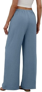 Detail of grey-blue wide-leg trousers with elastic waistband and pleated texture
