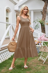 Detail view of the elegant sleeveless square neck dress with tiered ruffle hem in brown