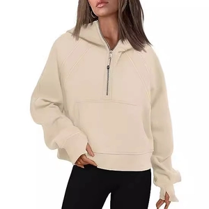 Women's beige half-zip hoodie featuring dropped shoulders, thumbholes and kangaroo pocket