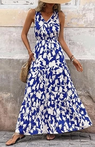 Detail of blue floral print tiered skirt with flowy lightweight fabric on summer maxi dress