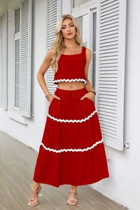 Dettagli del set top senza maniche rosso e gonna lunga con bordo smerlato bianco