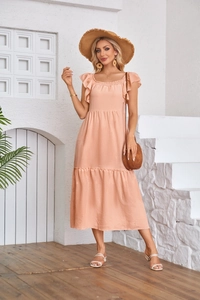 Detail of peach ruffled flutter sleeve dress with square neck and tiered flowy skirt