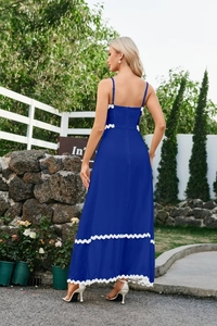 Close-up of royal blue maxi dress showing white ric-rac trim and smocked elastic back detail