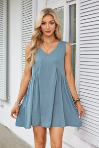 Detail view of V-neck sleeveless mini dress featuring soft Morandi blue pleated fabric