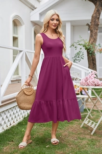 Detail view of fuchsia sleeveless tiered dress with square neck and side pockets