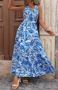 Detail of blue floral maxi dress with V-neck, elastic waist, and layered cake hem design