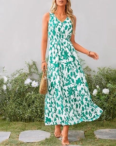 Detail of V-neck sleeveless floral maxi dress with green tulip print and tiered skirt